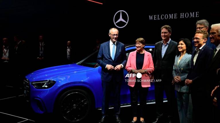 (L-R) German Chancellor Friedrich Merz, German Association of the Automotive Industry (VDA) President Hildegard Mueller, CEO of Mercedes-Benz AG Ola Kaellenius and German Economy and Energy Minister Katherina Reiche pose for a group photo at the Mercedes booth during the opening day of the International Motor Show IAA on September 9, 2025, in Munich, southern Germany. - AFP