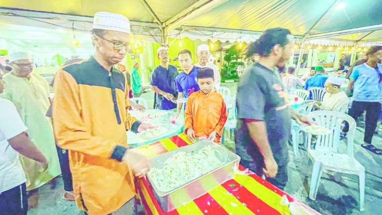 Experts advocate moderation during moreh by consuming healthier and balanced portions of the variety of food offered. – ADIB RAWI YAHYA/THESUN