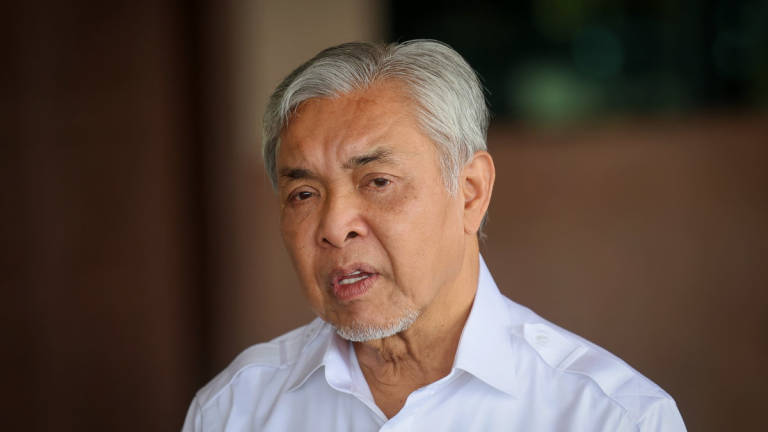 Deputy Prime Minister Datuk Seri Dr Ahmad Zahid Hamidi holds a press conference at Subang Air Base after taking part in the Cloud Seeding Operation (OPA) at the Bukit Merah Dam in Perak using a C-130H aircraft, today. – BERNAMA