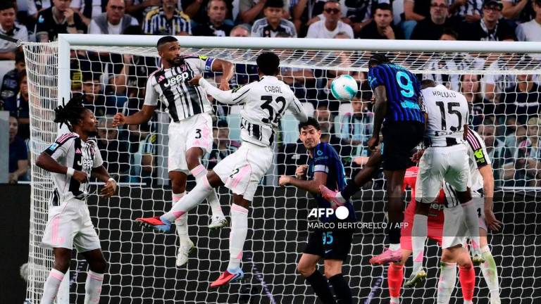 Inter Milan's French forward #09 Marcus Thuram (C) heads the ball and scores his team third goal during the Italian Serie A football match between Juventus and Inter Milan at the Allianz stadium in Turin, northern Italy, on September 13, 2025. - AFP