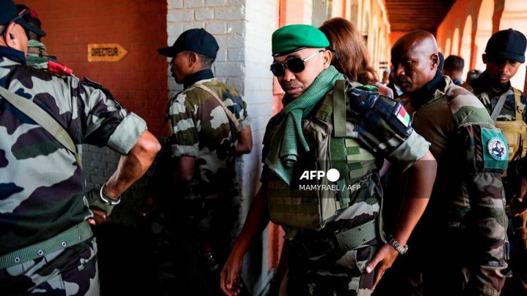 Colonel Michael Randrianirina (C) from the mutinied CAPSAT military contingent arrives to speak to an audience in Antananarivo on October 16, 2025. - AFP