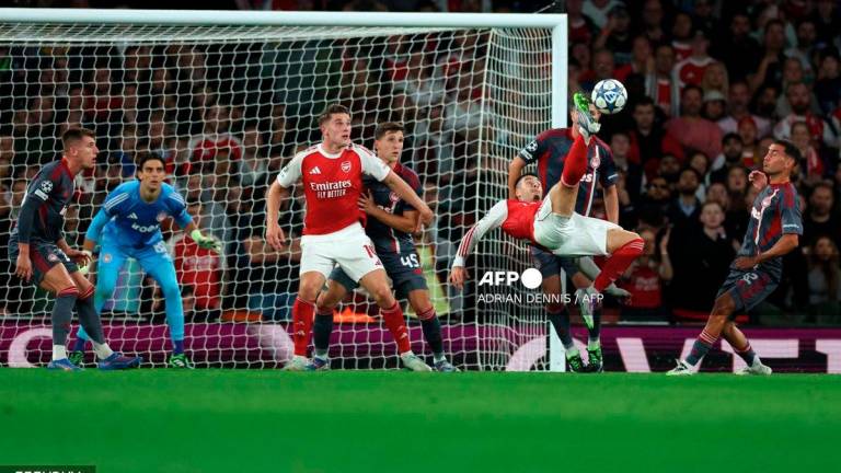 Arsenal's Brazilian midfielder #11 Gabriel Martinelli shoots but fails to score during the UEFA Champions League, league phase football match between Arsenal and Olympiacos at the Emirates Stadium in north London on October 1, 2025. - AFP