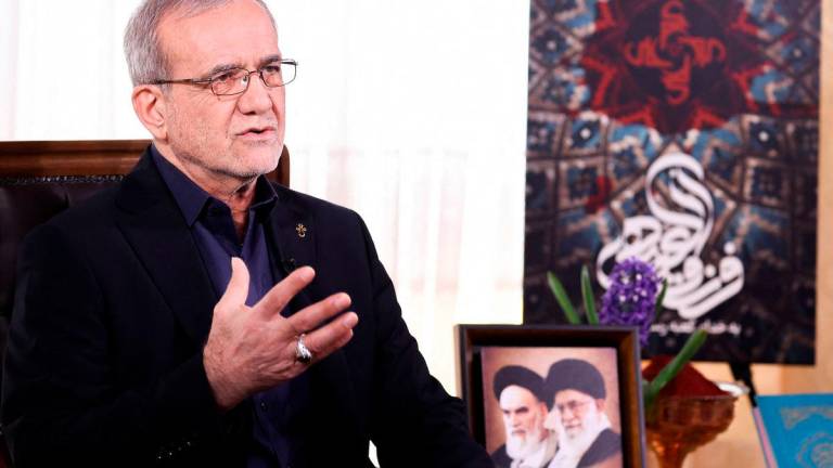 This handout picture provided by the media office of the Iranian presidency shows the Islamic republic’s President Masoud Pezeshkian during the annual address to the nation for Nowruz, the Persian New Year, in Tehran on March 20, 2025. (Photo by IRANIAN PRESIDENCY / AFP)