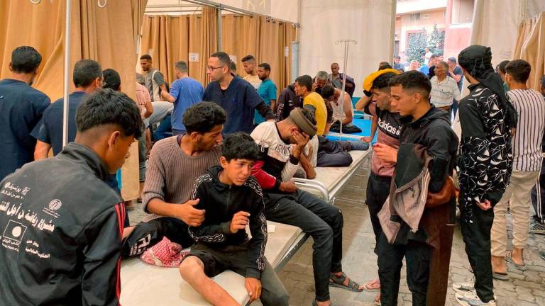 Palestinians who were injured in Israeli fire as they gathered near a food aid centre, receive care at Khan Yunis’ Nasser hospital in the southern Gaza Strip on June 17, 2025. (Photo by AFP)