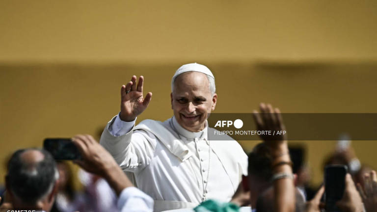 Pope Leo XIV waves to faithfuls as he leaves after leading a mass in the Tor Vergata district of Rome, as part of Jubilee of Youth, on August 3, 2025. - AFP