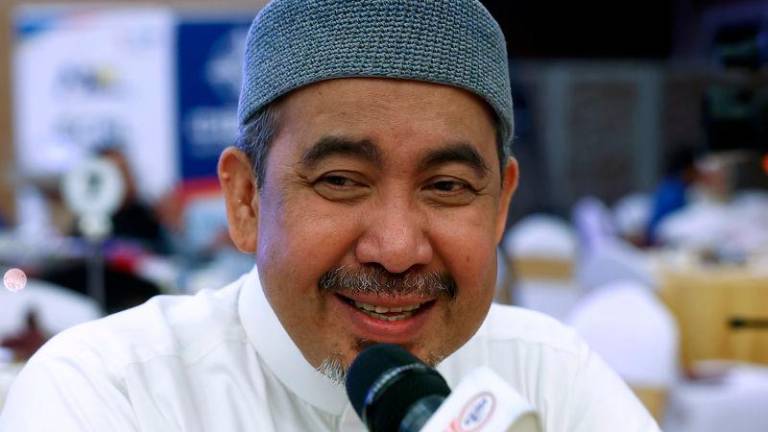 Pengerusi Jawatankuasa Kerja Raya, Infrastruktur, Air dan Pembangunan Luar Bandar Kelantan Datuk Dr Izani Husin - fotoBERNAMA