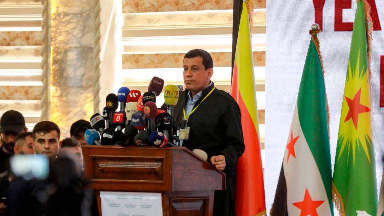 Mazloum Abdi, commander-in-chief of the Syrian Democratic Forces (SDF), speaks during the pan-Kurdish “Unity and Consensus” conference in Qamishli in northeastern Syria on April 26, 2025. (Photo by Delil SOULEIMAN / AFP)