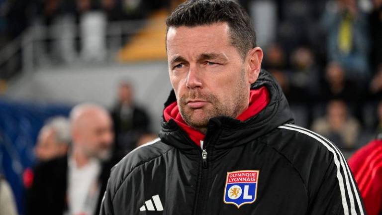 Lyon's French coach Pierre Sage looks on before the start of the UEFA Europa League, league phase football match between Fenerbahce and Olympique Lyonnais (OL) at the Sukru Saracoglu Stadium in Istanbul on January 23, 2025. - AFPPIX