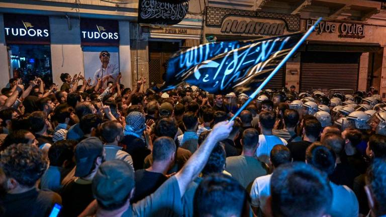 Islamist protesters clash with Turkish anti riot police officers as they gather to protests Leman cartoon magazine in Istanbul on June 30, 2025. (Photo by Ozan KOSE / AFP)