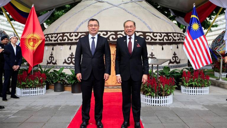 Prime Minister Datuk Seri Anwar Ibrahim poses for a photo with the President of the Kyrgyz Republic, Sadyr Japarov, during a visit to the traditional Kyrgyz yurt, Boz Ui, on display at the Putrajaya Corporation Complex today. - BERNAMAPIX