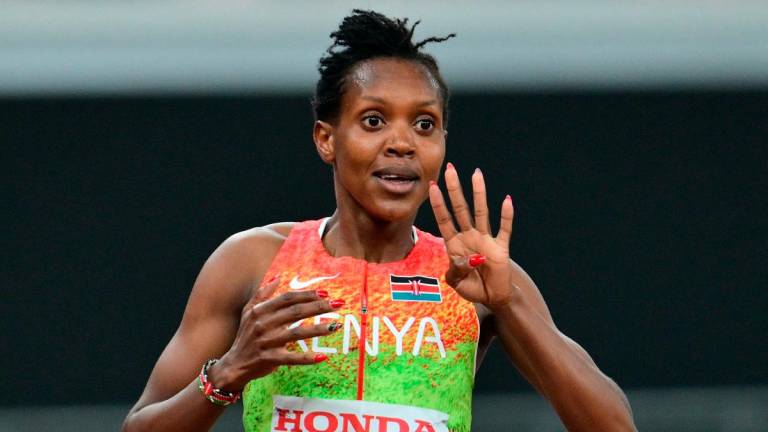 Kenya's Faith Kipyegon celebrates after winning the women's 1500m final during the World Athletics Championships in Tokyo on September 16, 2025. - Andrej ISAKOVIC / AFP