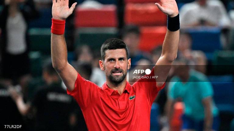 Serbia's Novak Djokovic reacts after winning against Croatia's Marin Cilic in their men's singles match at the Shanghai Masters tennis tournament in Shanghai on October 3, 2025. - AFP