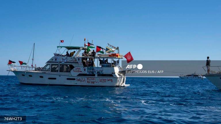 Members of the group of ships of the Global Sumud Flotilla to Gaza are seen moored at the small island of Koufonisi, south of the island of Crete, on September 26, 2025. - AFP