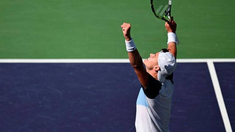 Denmark's Holger Rune celebrates defeating Russia's Daniil Medvedev during the men’s singles semi-final tennis match at the BNP Paribas Open at the Indian Wells Tennis Garden in Indian Wells, California, on March 15, 2025. - AFPPIX