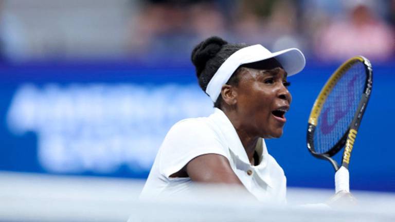 Venus Williams of the United States returns a shot against Karolina Muchova of Czech Republic during their Women's Singles First Round match on Day Two of the 2025 US Open at USTA Billie Jean King National Tennis Center on August 25, 2025 in the Flushing neighborhood of the Queens borough of New York City. - Elsa/Getty Images/AFPPIX