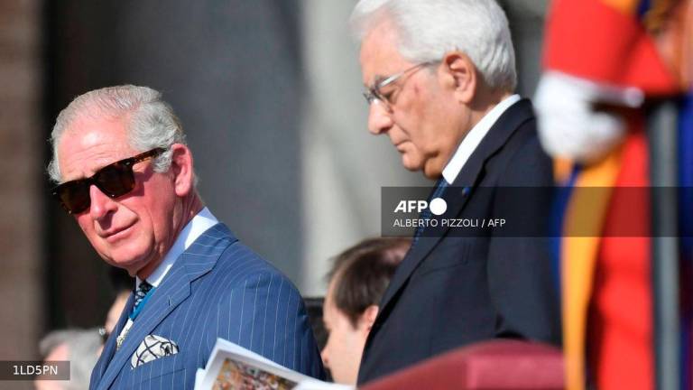 Charles, Prince of Wales (L) flanked by Italy's Republic President Sergio Mattarella attends the Canonization Mass for English John Henry Newman, Italian Giuseppina Vannini, Indian Maria Teresa Chiramel Mankidiyan, Brazilian Dulce Lopes Pontes, and Swiss Margarita Bays on October 13, 2019 In Saint Peter's square at the Vatican. - AFP