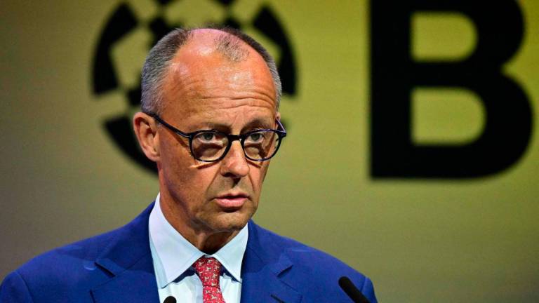 German Chancellor Friedrich Merz delivers his speech during the “Day of German Industry” conference for economic policy organized by the Federation of German Industries (BDI) in Berlin on June 23, 2025. (Photo by Tobias SCHWARZ / AFP)