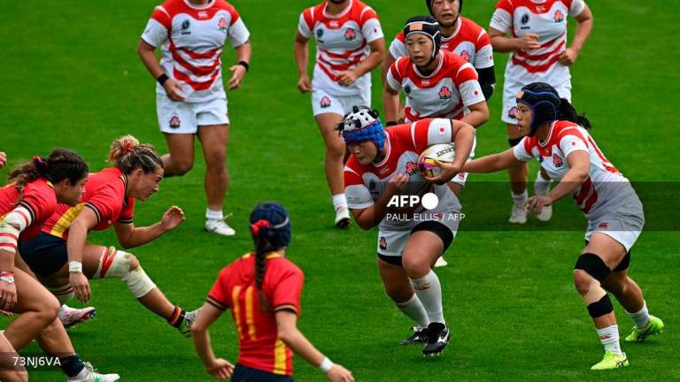 Japan’s prop Sachiko Kato (C) makes a break during the Women’s Rugby World Cup pool C match between Japan and Spain at York Community Stadium, York, northern England, on September 7, 2025. (Photo by Paul ELLIS / AFP)
