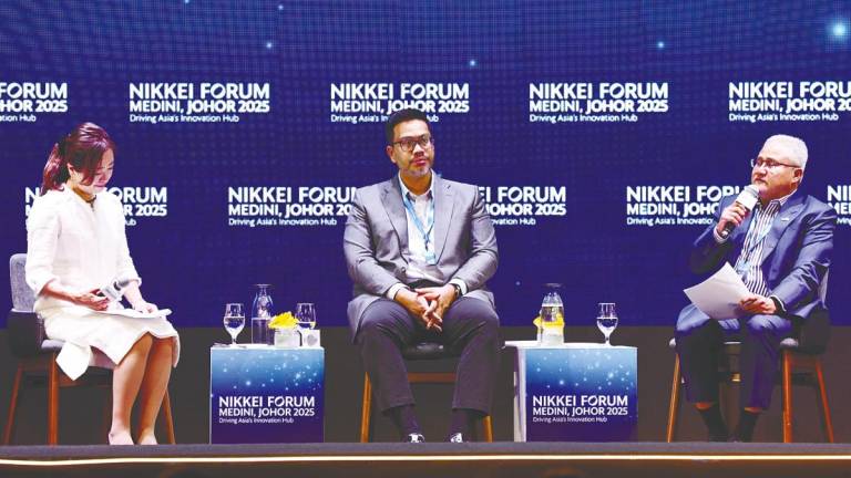 Moderator Koori Takahashi, Idzham and Noorazam at the panel discussion. – BERNAMAPIC