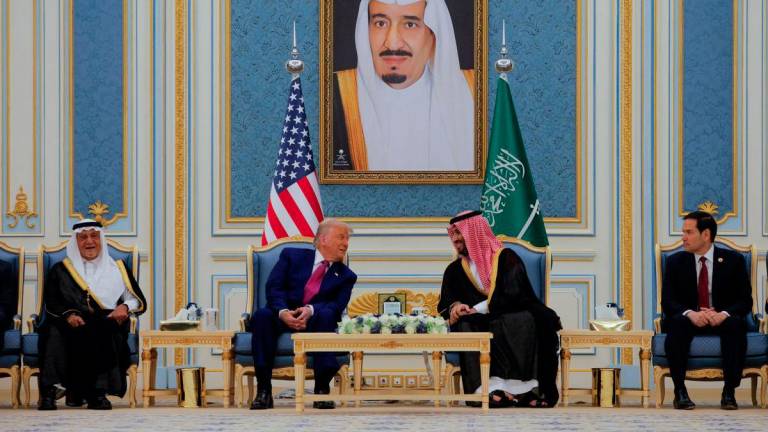 U.S. President Donald Trump and Saudi Crown Prince Mohammed Bin Salman speak as they meet in Riyadh, Saudi Arabia, May 13, 2025. REUTERSPIX