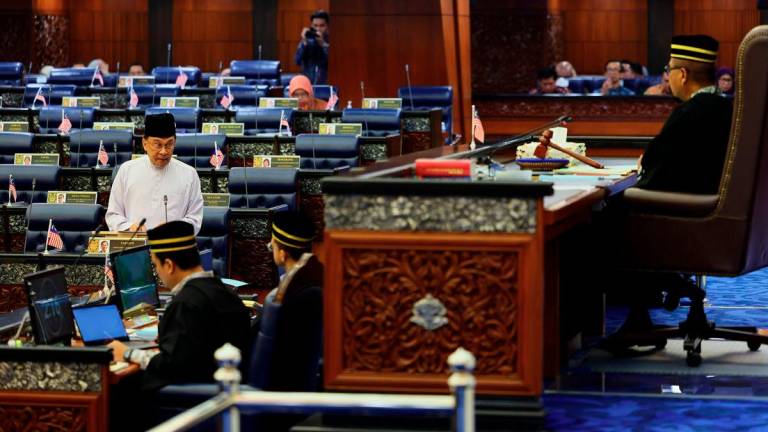 Prime Minister Datuk Seri Anwar Ibrahim answers questions during the Second Meeting of the Fourth Session of the 15th Parliament in the Dewan Rakyat, Parliament Building, today. - BERNAMA