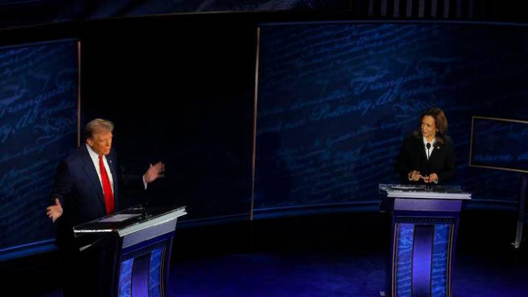 Republican presidential nominee, former U.S. President Donald Trump speaks as Democratic presidential nominee, U.S. Vice President Kamala Harris listens as they attend a presidential debate hosted by ABC in Philadelphia - REUTERSpix