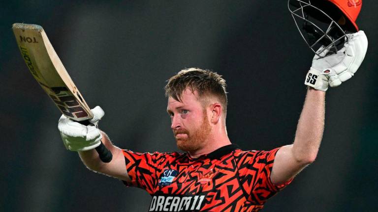 Sunrisers Hyderabad’s Heinrich Klaasen celebrates after scoring a century (100 runs) during the Indian Premier League (IPL) Twenty20 cricket match between Kolkata Knight Riders and Sunrisers Hyderabad at the Arun Jaitley Stadium in New Delhi on May 25, 2025. (Photo by Money SHARMA / AFP)