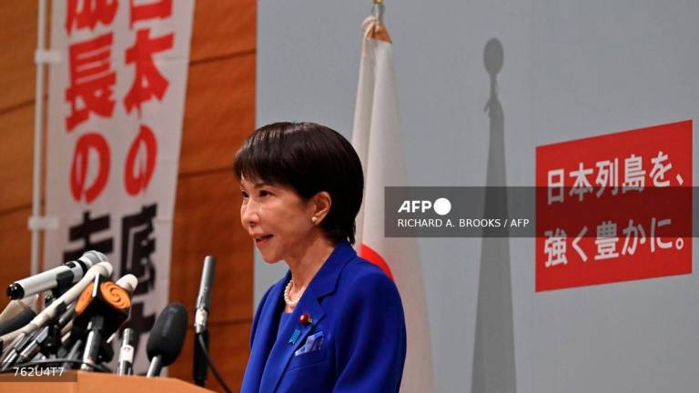Japanese veteran Liberal Democratic Party (LDP) lawmaker Sanae Takaichi speaks to the media during a press conference in Tokyo on September 19, 2025. - AFP