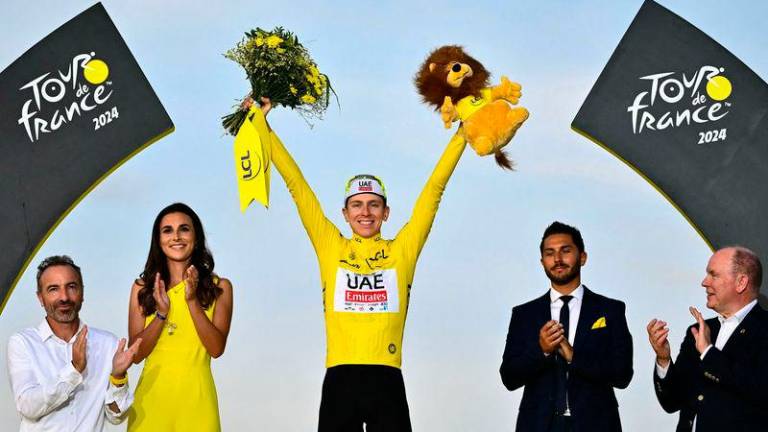 UAE Team Emirates team’s Slovenian rider Tadej Pogacar celebrates his overall victory on the podium with the overall leader’s yellow jersey after the 21st and final stage of the 111th edition of the Tour de France cycling race, a 33,7 km individual time-trial between Monaco and Nice - AFPpix