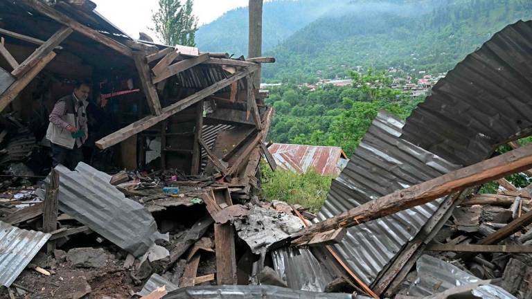 A local resident inspects the debris of his house that was destroyed by Pakistani artillery shelling at the Lagama village in Uri, about 100kms from Srinagar, on May 9, 2025. India and Pakistan accused each other on May 8 of carrying out waves of drone attacks, as deadly confrontations between the nuclear-armed foes drew global calls for calm. - AFPPIX