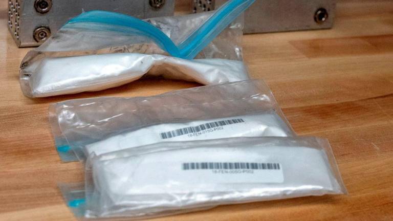 Packages of fentanyl which are placed in bite proof metal containers are used to train drug-sniffing dogs for U.S. Customs and Border Protection to help curb the transit of fentanyl and other drugs, in Front Royal, Virginia, U.S., June 18, 2024. - REUTERSPIX