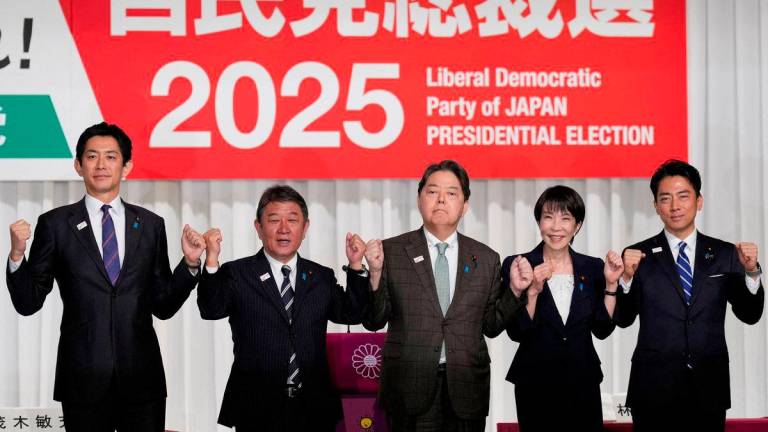 Japan's former Economic Security Minister Takayuki Kobayashi, former Foreign Minister Toshimitsu Motegi, Chief Cabinet Secretary Yoshimasa Hayashi, former Economic Security Minister Sanae Takaichi and Agriculture Minister Shinjiro Koizumi pose at the Liberal Democratic Party (LDP) presidential election candidates joint press conference at LDP headquarters, in Tokyo, Japan September 23, 2025. - Eugene Hoshiko/Pool via REUTERSPIX
