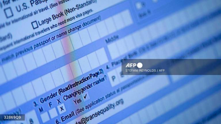 A partially completed passport application, with an “X” gender marker, is seen on a computer monitor in Alexandria, Virginia, on April 11, 2022. - AFP
