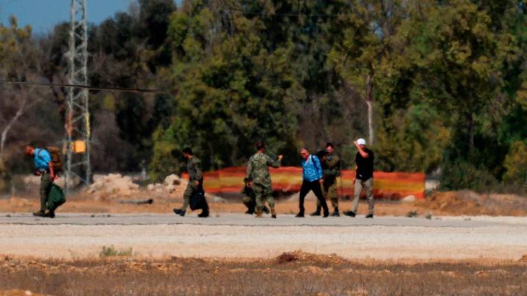 U.S. Special Envoy to the Middle East Steve Witkoff walks to board an Israeli black hawk helicopter from Reim military base, where the Israeli hostages are expected to arrive after their release, amid a ceasefire between Israel and Hamas in Gaza, in southern Israel, October 11, 2025. - REUTERS