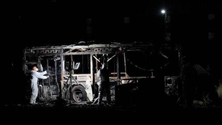 Security forces and bomb disposal units are deployed to the scene of a bus explosion in Bat Yam on February 20, 2025. - AFPPIX