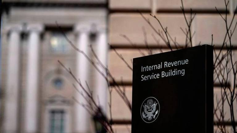 A sign stands outside the U.S. Internal Revenue Service (IRS) building after it was reported the IRS will lay off about 6,700 employees, a restructuring that could strain the tax-collecting agency's resources during the critical tax-filing season, in Washington, D.C., February 20, 2025. - REUTERSPIX