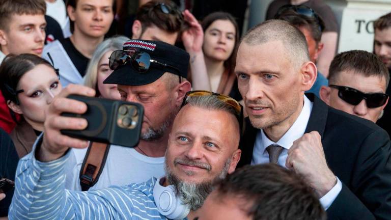 Belarusian oppositionists Sergei Tikhanovsky (R) poses for pictures during a rally organised by Belarusian diaspora in Warsaw, Poland, on June 26, 2025. - AFPPIX