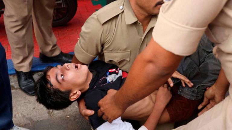 A boy lies unconscious following a stampede outside a cricket stadium in Bengaluru, India, June 4, 2025. REUTERS.