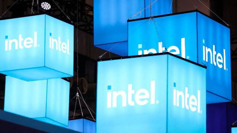 The logo of Intel is seen during the Computex 2024 expo in Taipei on June 4, 2024. Chip-making giant Intel on September 16, 2024 said it was delaying its plans to build two mega chip-making factories in Germany and Poland as the company faces lower demand than anticipated. - AFPPIX