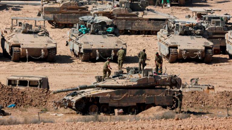 Israeli troops deploy at the border fence with the Gaza Strip in southern Israel, on September 9, 2025.- REUTERSPIX