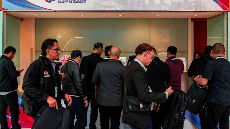 Media practitioners collect their passes ahead of the 58th ASEAN Foreign Ministers’ Meeting (AMM) and related Meetings at the Kuala Lumpur Convention Centre (KLCC). - BERNAMAPIX