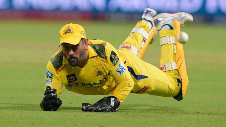 Chennai Super Kings’ Mahendra Singh Dhoni dives to stop a ball during the Indian Premier League (IPL) Twenty20 cricket match between Kolkata Knight Riders and Chennai Super Kings at the Eden Gardens in Kolkata on May 7, 2025. AFPpix