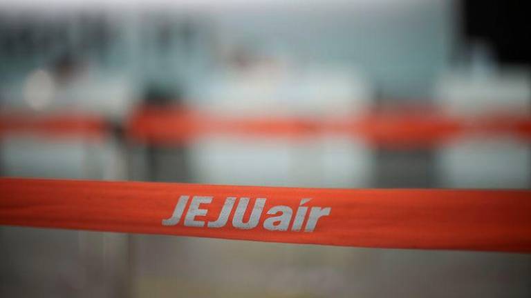 A barricade with the logo of Jeju Air is placed at Muan International Airport - REUTERSpix