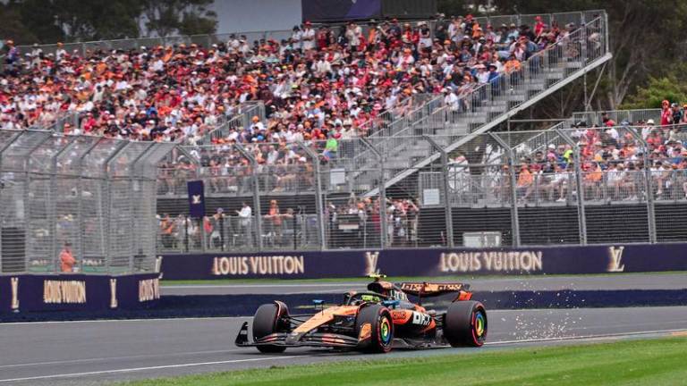 McLaren's British driver Lando Norris drives during the qualifying session of the Formula One Australian Grand Prix at the Albert Park Circuit in Melbourne on March 15, 2025. - AFPPIX