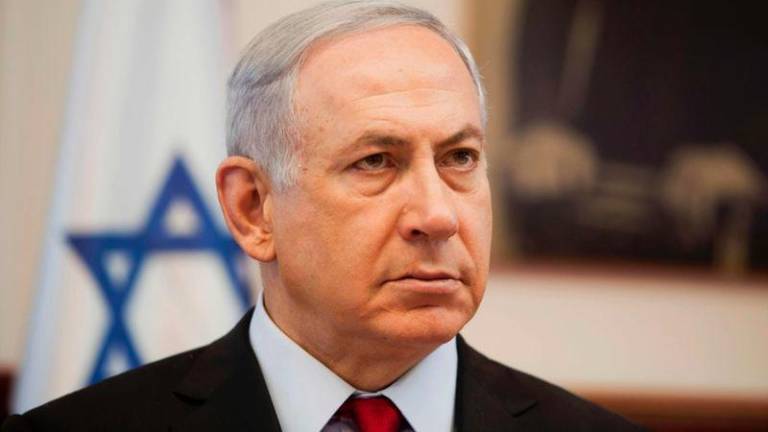 Israeli Prime Minister Benjamin Netanyahu looks on as he chairs the weekly cabinet meeting in his Jerusalem office on June 26, 2016. - AFPPIX