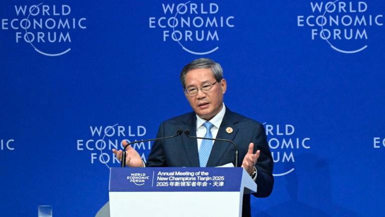 Chinese Premier Li Qiang delivers a speech during opening ceremony of the World Economic Forum Annual Meeting of the New Champions (AMNC25) in Tianjin on June 25, 2025. - AFPPIX