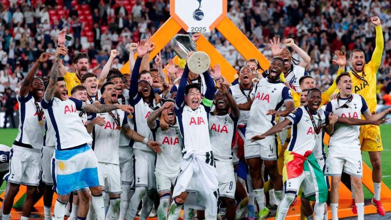 Tottenham Hotspur's South Korean forward #07 Son Heung-min raises the trophy as he celebrates with teammates winning the UEFA Europa League final football match between Tottenham Hotspur and Manchester United at San Mames stadium in Bilbao on May 21, 2025. - AFPPIX