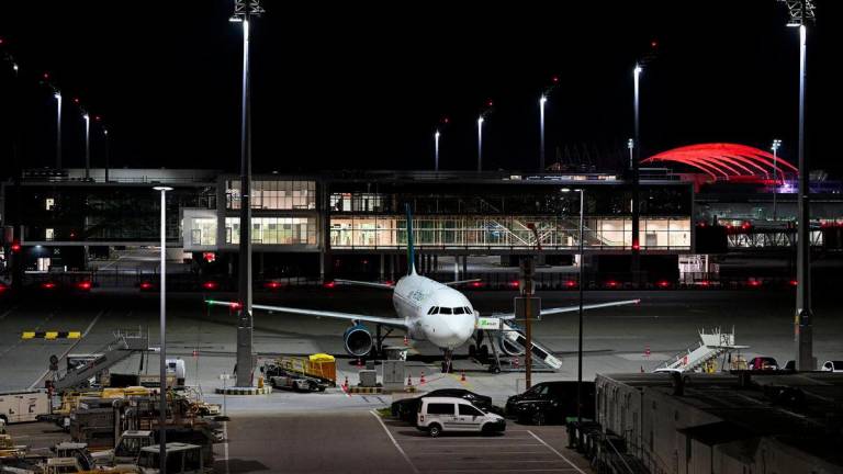 An airplane is parked at the airport in Munich, Germany, October 4, 2025, after both runways were closed on Friday evening for the second time in less than 24 hours, with the captain on an aircraft whose departure was canceled telling passengers that drones had once again been sighted. - REUTERSPIX