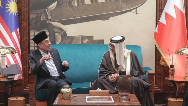 Prime Minister Datuk Seri Anwar Ibrahim (left) speaks with Bahraini Foreign Affairs Minister Dr Abdullatif Rashid Al Zayani upon arriving at the Bahrain International Airport for a three-day official visit to Bahrain under the invitation of Bahrain’s Crown Prince and Prime Minister Salman Hamad Al Khalifa. - BERNAMAPIX