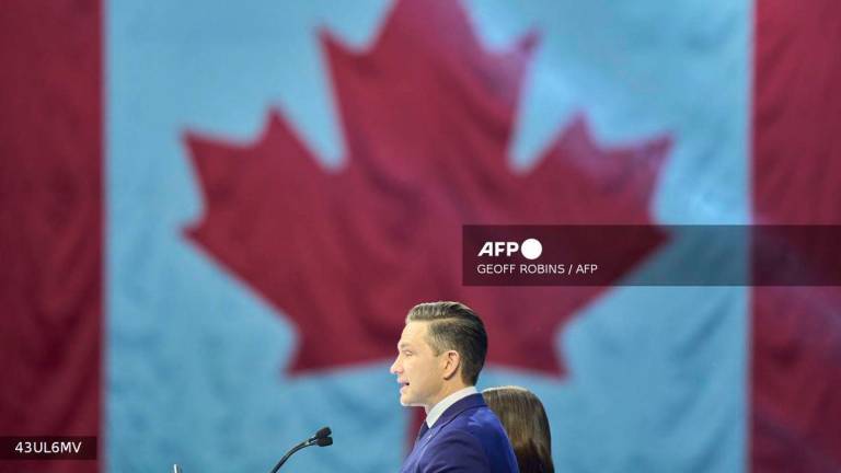 Canada's Conservative leader Pierre Poilievre speaks alongside his wife Anaida at the Conservative election party at the Rogers Centre in Ottawa, Ontario on April 28, 2025. - AFP
